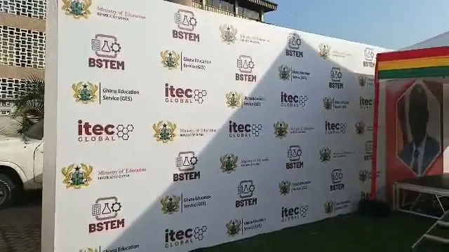 BSTEM and itec Global branded wall beside a tented stage